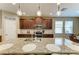 Kitchen with large island, granite countertops, stainless steel appliances, and pendant lighting at 5307 65Th E Ter, Ellenton, FL 34222