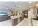 Spacious open-concept kitchen with a large island, stainless steel appliances, and adjoining living spaces at 5307 65Th E Ter, Ellenton, FL 34222