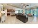 Bright, open-concept space with tile flooring, a comfortable seating area, and kitchen view at 5307 65Th E Ter, Ellenton, FL 34222