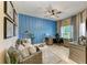 Cozy home office with built-in shelving, a comfortable seating area, and plenty of natural light at 5307 65Th E Ter, Ellenton, FL 34222