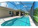 Private pool and patio area surrounded by a screened enclosure and lush greenery at 5307 65Th E Ter, Ellenton, FL 34222