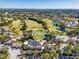 Aerial view of the beautiful golf course, community and lush surroundings with ponds and gorgeous views at 5349 Everwood Run, Sarasota, FL 34235