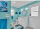 Bright bathroom featuring a single vanity, toilet, decorative mirror, and stylish decor at 5349 Everwood Run, Sarasota, FL 34235