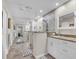 A spacious bathroom featuring double vanity sinks, a step-in shower, and ample counter space at 5349 Everwood Run, Sarasota, FL 34235
