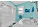 Well-lit bathroom featuring a glass-enclosed shower, vanity with sink, and modern fixtures at 5349 Everwood Run, Sarasota, FL 34235