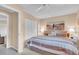 Well-lit bedroom showcases a comfortable queen bed, soft colors, and closet space at 5349 Everwood Run, Sarasota, FL 34235