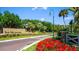 Beautiful entrance sign to The Meadows community, surrounded by colorful flowers and landscaping at 5349 Everwood Run, Sarasota, FL 34235