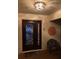 Inviting front entryway with an ornate door, textured walls, and decorative accents creating a welcoming ambiance at 5349 Everwood Run, Sarasota, FL 34235