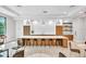 Stylish kitchen with island and bar seating perfect for gatherings and casual dining at 5349 Everwood Run, Sarasota, FL 34235