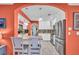 Modern kitchen featuring white cabinetry, stainless steel appliances, granite countertops, and an arched entry at 5349 Everwood Run, Sarasota, FL 34235