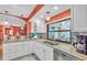 Inviting kitchen with white cabinetry, granite counters, stainless steel appliances, and open layout at 5349 Everwood Run, Sarasota, FL 34235