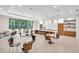 Bright and spacious kitchen with a large island, seating, modern appliances, and a view to lush landscaping at 5349 Everwood Run, Sarasota, FL 34235
