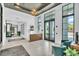 Welcoming lobby with high ceilings, abundant natural light, and stylish seating area at 5349 Everwood Run, Sarasota, FL 34235