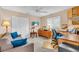 Bright, multi-purpose space perfect for office or living, with neutral colors, and shuttered windows at 5349 Everwood Run, Sarasota, FL 34235