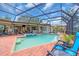 Beautiful enclosed pool area with a view to interior of home and backyard at 5349 Everwood Run, Sarasota, FL 34235