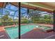 Backyard pool area with enclosed pool and hot tub, and poolside furniture at 5349 Everwood Run, Sarasota, FL 34235