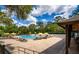 Relaxing pool area with lounge chairs and umbrellas for residents to enjoy on a sunny day at 5349 Everwood Run, Sarasota, FL 34235