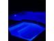 Backyard pool and hot tub illuminated with blue lights offer a private oasis for relaxation and entertainment at 5349 Everwood Run, Sarasota, FL 34235