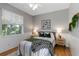 Serene bedroom with natural light, light-colored walls, stylish decor, creating a relaxing retreat at 5401 Oak Grove Ct, Sarasota, FL 34233