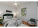 Inviting bedroom with a comfortable bed, natural light, and stylish decor at 5401 Oak Grove Ct, Sarasota, FL 34233