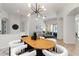 Open-concept dining room featuring contemporary lighting and stylish furniture at 5401 Oak Grove Ct, Sarasota, FL 34233