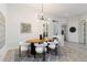 Cozy dining area with stylish lighting, modern decor, and views of the outdoors at 5401 Oak Grove Ct, Sarasota, FL 34233