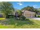 Charming single-story home with a well-maintained lawn and a three-car garage at 5401 Oak Grove Ct, Sarasota, FL 34233
