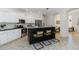 Updated kitchen with a large island, stainless steel appliances, and white cabinets at 5401 Oak Grove Ct, Sarasota, FL 34233