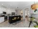 Well lit kitchen featuring a large island with seating, and stainless steel appliances at 5401 Oak Grove Ct, Sarasota, FL 34233