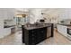 Spacious kitchen features a large island, stainless steel appliances, and white cabinetry at 5401 Oak Grove Ct, Sarasota, FL 34233