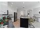 Bright kitchen features a large island with seating, and stainless steel refrigerator at 5401 Oak Grove Ct, Sarasota, FL 34233