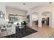 Open living space with ample seating, stylish decor, and easy access to kitchen and patio at 5401 Oak Grove Ct, Sarasota, FL 34233
