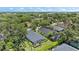 Aerial view of a single-Gathering home with mature trees, lush landscaping and screen lanai at 5508 Whitehead St, Bradenton, FL 34203