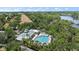 Aerial view of the community pool and spa, with tropical landscaping and views of the intracoastal at 5508 Whitehead St, Bradenton, FL 34203