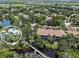 An aerial view of the community with a community pool and scenic bridge across the water at 5508 Whitehead St, Bradenton, FL 34203
