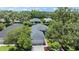 Aerial view of a single-Gathering home with mature trees and lush landscaping at 5508 Whitehead St, Bradenton, FL 34203