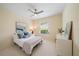 Comfortable bedroom featuring neutral decor, natural light, and cozy bedding creating a welcoming space at 5508 Whitehead St, Bradenton, FL 34203
