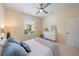 Bright bedroom featuring a ceiling fan, natural light, and a tranquil ambiance at 5508 Whitehead St, Bradenton, FL 34203