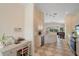 Open-concept kitchen features white cabinets, bar seating, and opens to dining area and living spaces at 5508 Whitehead St, Bradenton, FL 34203