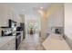 Bright kitchen with stainless steel appliances, white cabinets, and a dining nook with natural light at 5508 Whitehead St, Bradenton, FL 34203