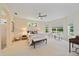 Relaxing bedroom featuring neutral decor, natural light, and a ceiling fan at 5508 Whitehead St, Bradenton, FL 34203