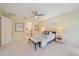Neutral bedroom with natural light, ensuite bath access, and cozy decor create a comfortable space at 5508 Whitehead St, Bradenton, FL 34203