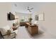 This office space includes a modern desk, ceiling fan and two cushioned lounge chairs at 5508 Whitehead St, Bradenton, FL 34203