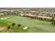 Beautiful aerial view of the community with a golf course, tennis courts, and ponds at 5528 Palmer Cir # 104, Bradenton, FL 34211