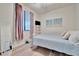 Inviting bedroom with a comfortable bed, stylish decor, and a bright window, creating a peaceful and relaxing atmosphere at 5528 Palmer Cir # 104, Bradenton, FL 34211
