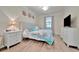 Well-lit bedroom featuring a comfortable bed, soft decor, and plenty of natural light creating a cozy and inviting space at 5528 Palmer Cir # 104, Bradenton, FL 34211