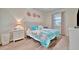 Serene bedroom showcasing a plush bed with stylish bedding and soft lighting, creating a tranquil retreat at 5528 Palmer Cir # 104, Bradenton, FL 34211