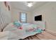 Charming bedroom featuring soft lighting, plush bedding, and a modern design for a soothing and restful environment at 5528 Palmer Cir # 104, Bradenton, FL 34211