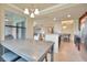 Open dining area with access to kitchen, stainless appliances and living room at 5528 Palmer Cir # 104, Bradenton, FL 34211