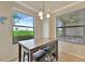Bright dining area with a window overlooking the golf course at 5528 Palmer Cir # 104, Bradenton, FL 34211